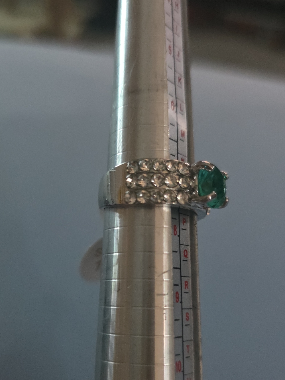Silver-Tone Ring with Emerald Green Center Stone and Clear Accents